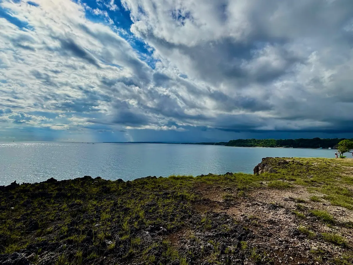 Panoramic view of the ocean from Siit Cliff in Siaton, Negros Oriental with dramatic storm clouds overhead